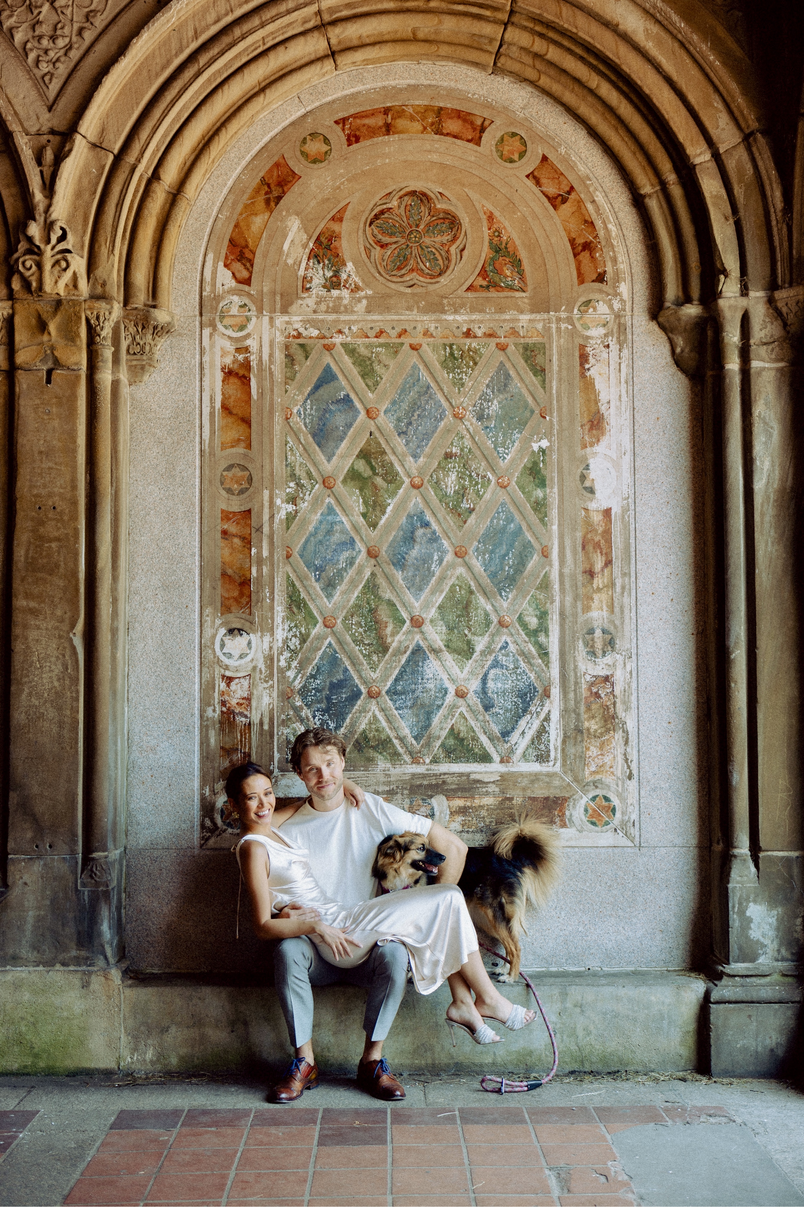 Kale and Mandy, founders of Sustainable Barks, with their rescue dog Piper at Bethesda Terrace in Central Park